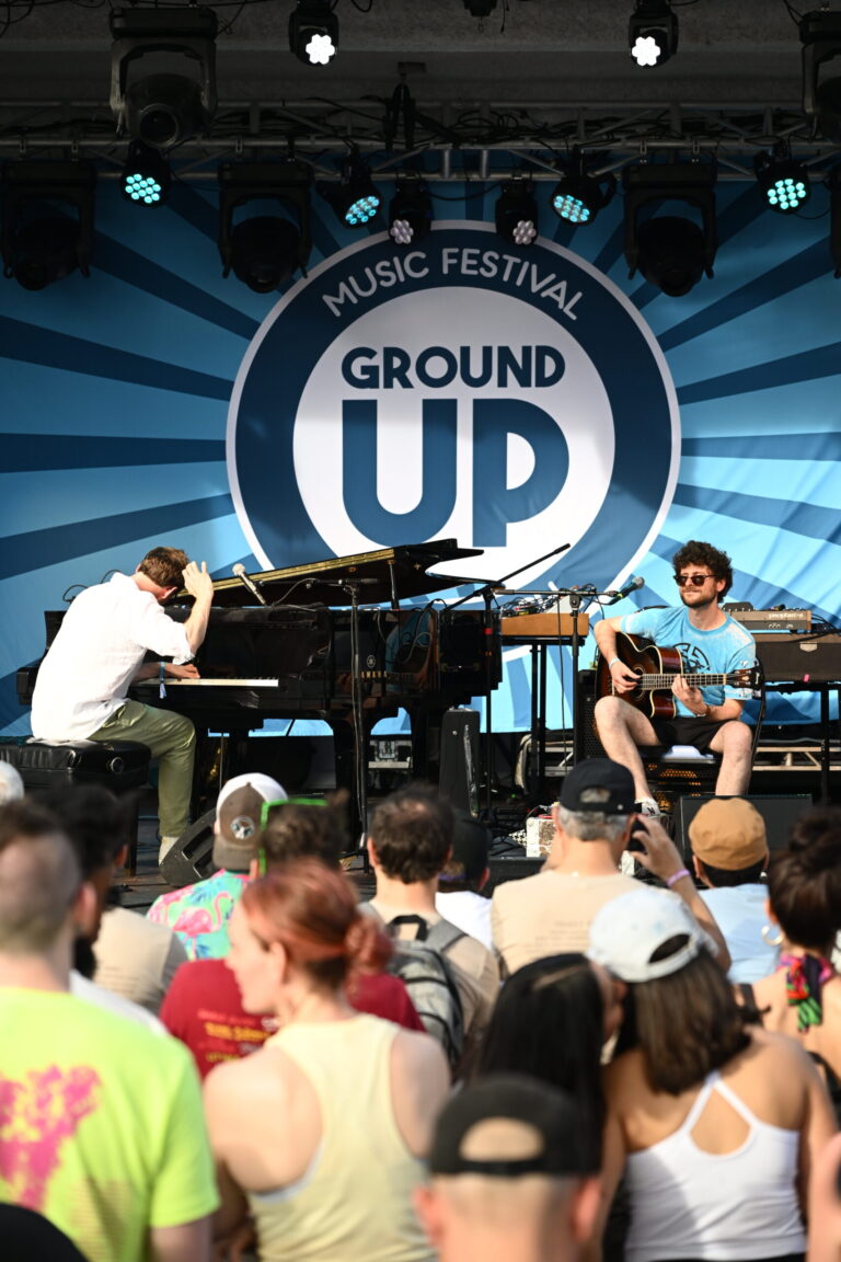 a group of people that are sitting on a stage