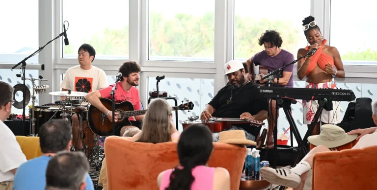 a group of people that are sitting in chairs