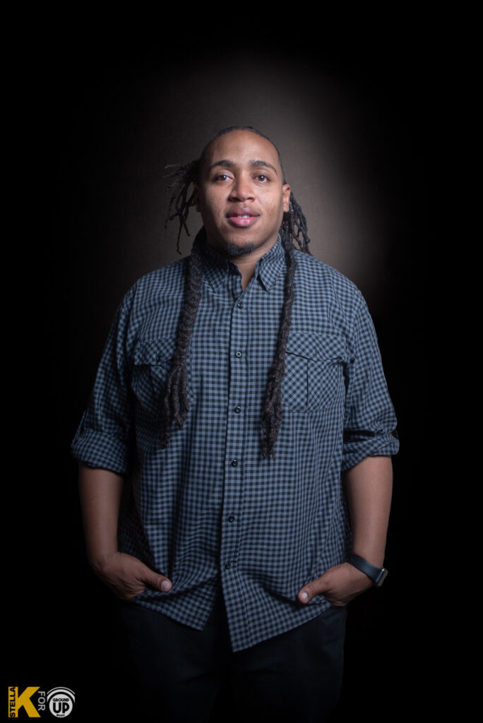 a man in a white shirt is posing for a picture