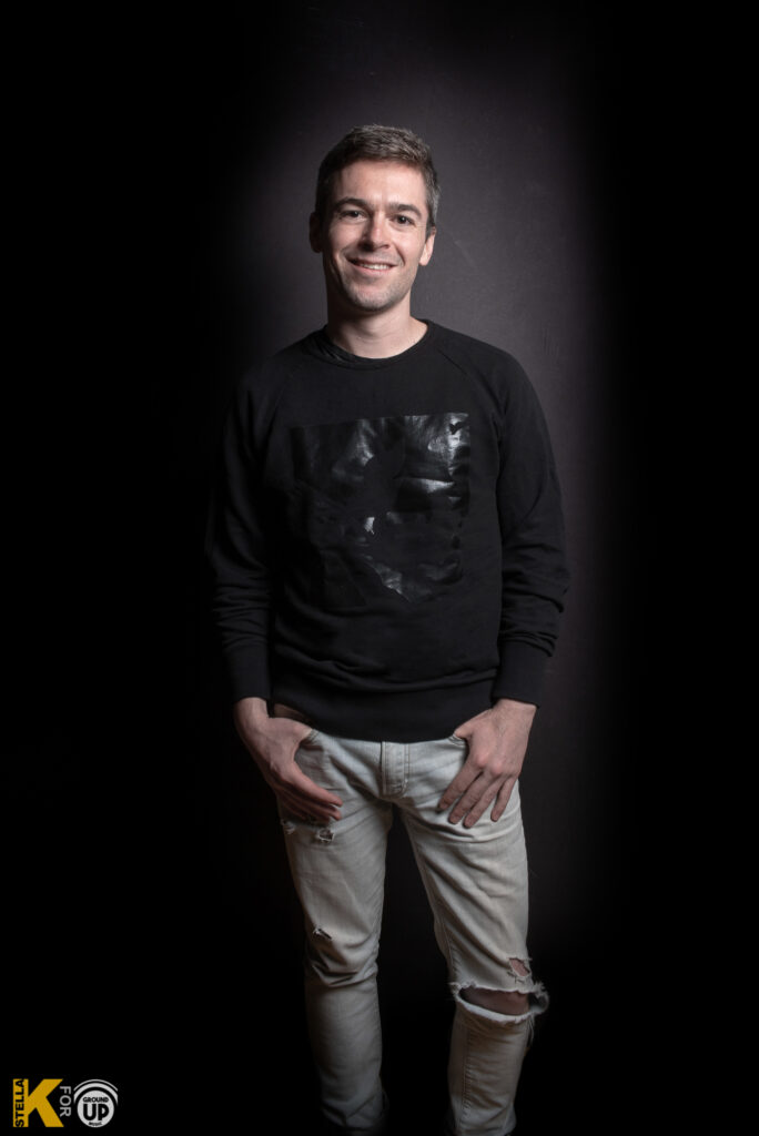 a man standing with his hands in his pockets