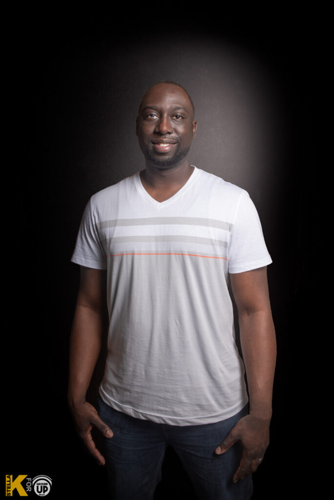 a man in a white shirt is posing for a picture