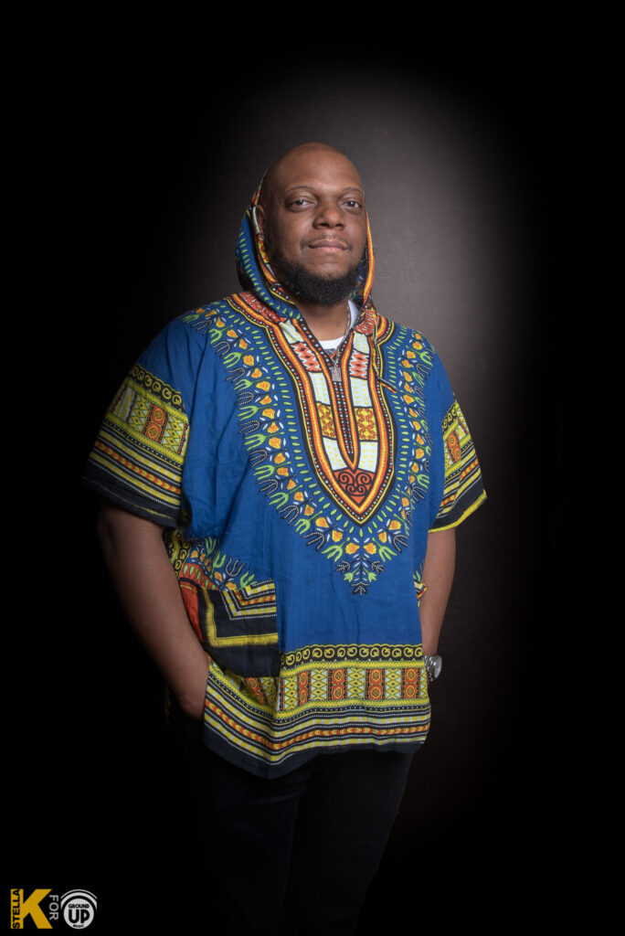 a man in a blue and yellow shirt