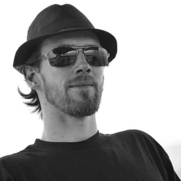 a man with a hat and sunglasses on