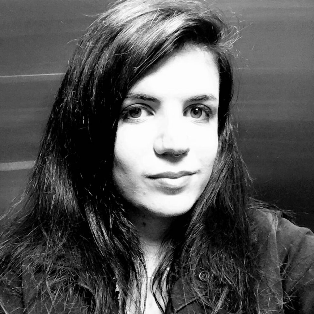 a black and white photo of a woman with long hair