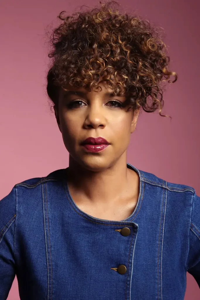 a close up of a person wearing a blue shirt